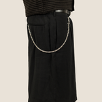 ICED London black knee-length shorts with a silver chain draped from the waistband to the pocket, side view.