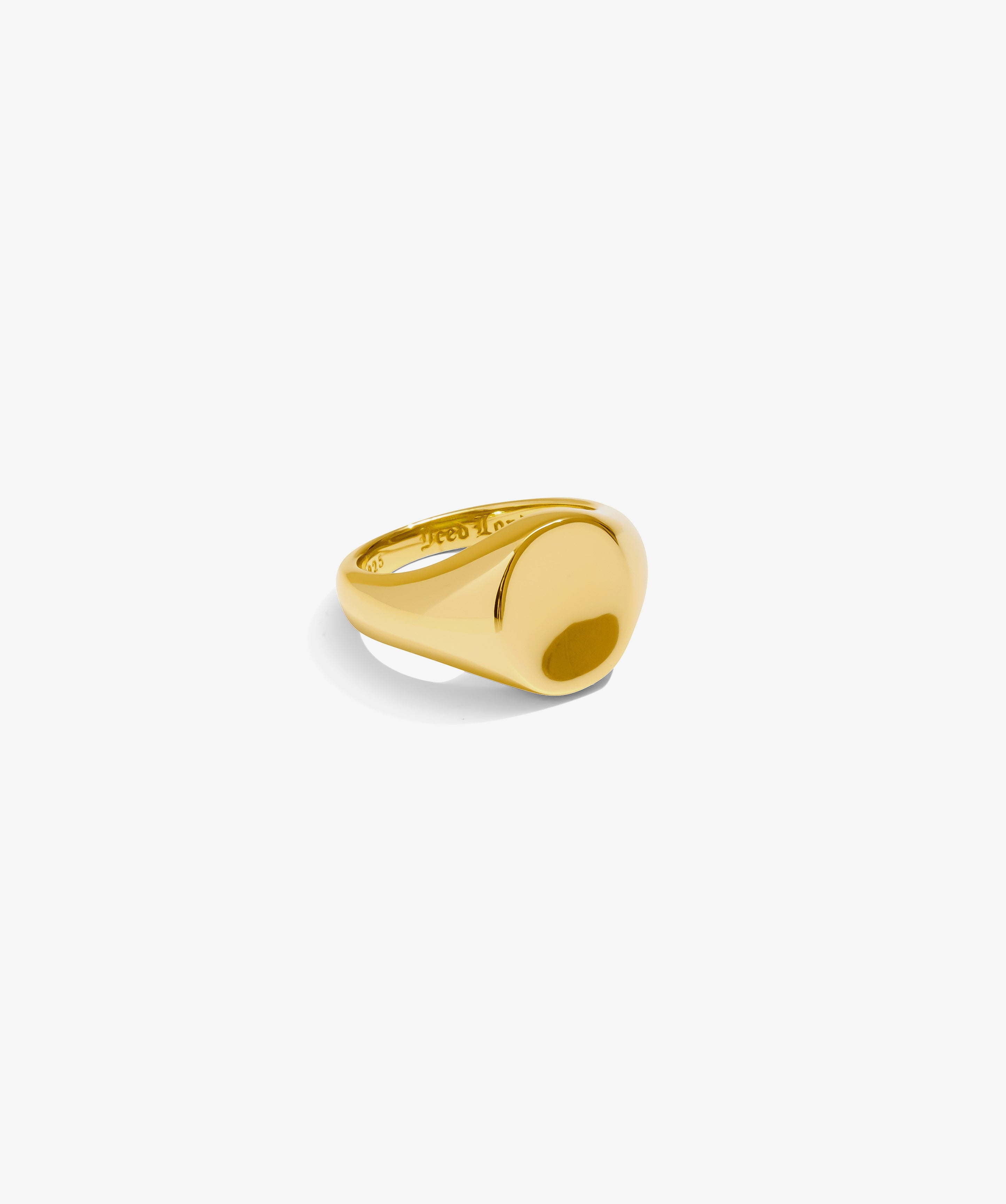 ICED London gold signet ring with a smooth domed face and polished finish on white background.