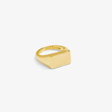 ICED London gold-tone signet ring with a flat square face and inner engraving reading “ICED London.”