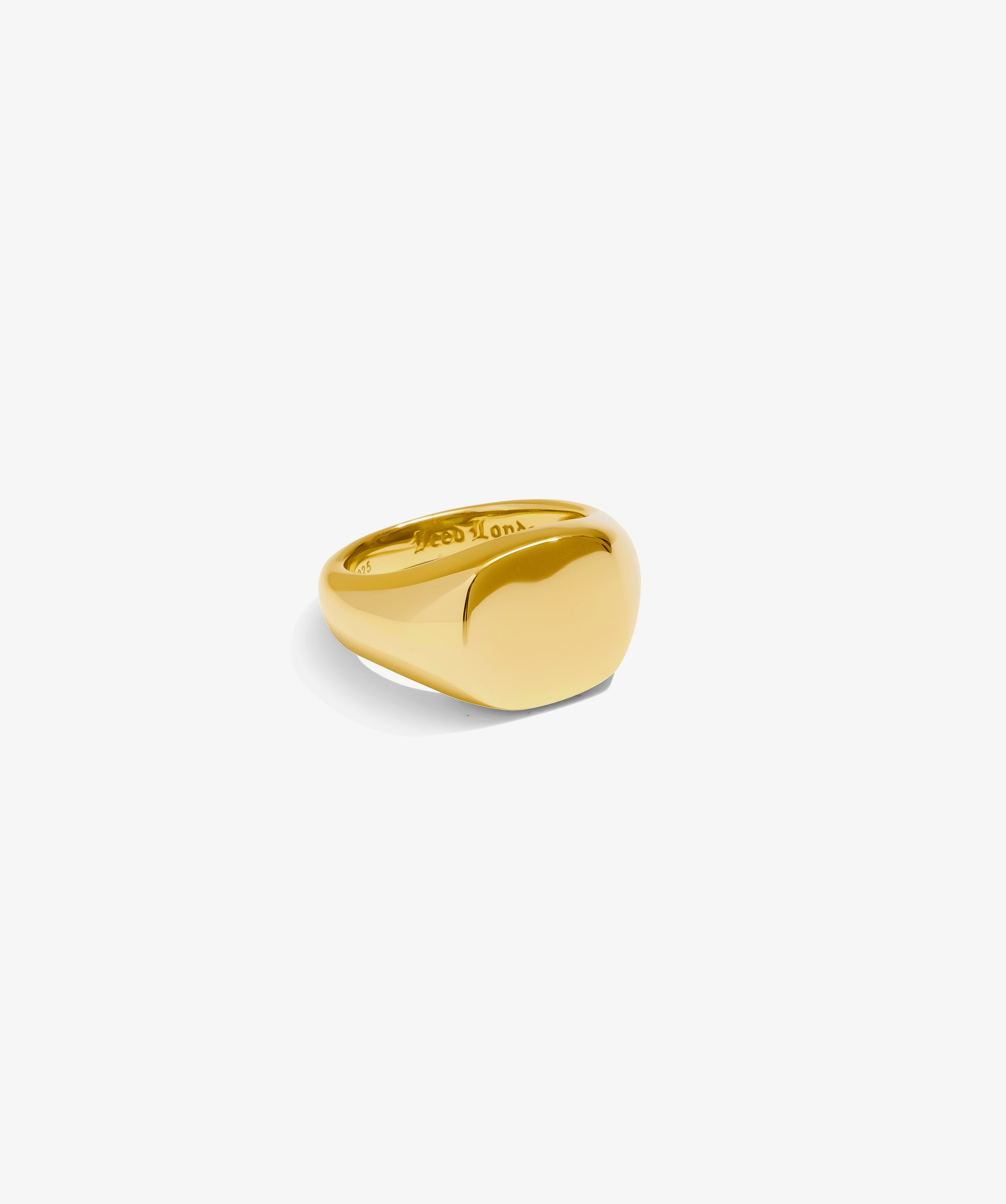 ICED London gold signet ring with a smooth, domed top and polished finish.
