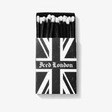 ICED London matchbox with a distressed Union Jack design, opened to reveal matches with white-tipped heads.