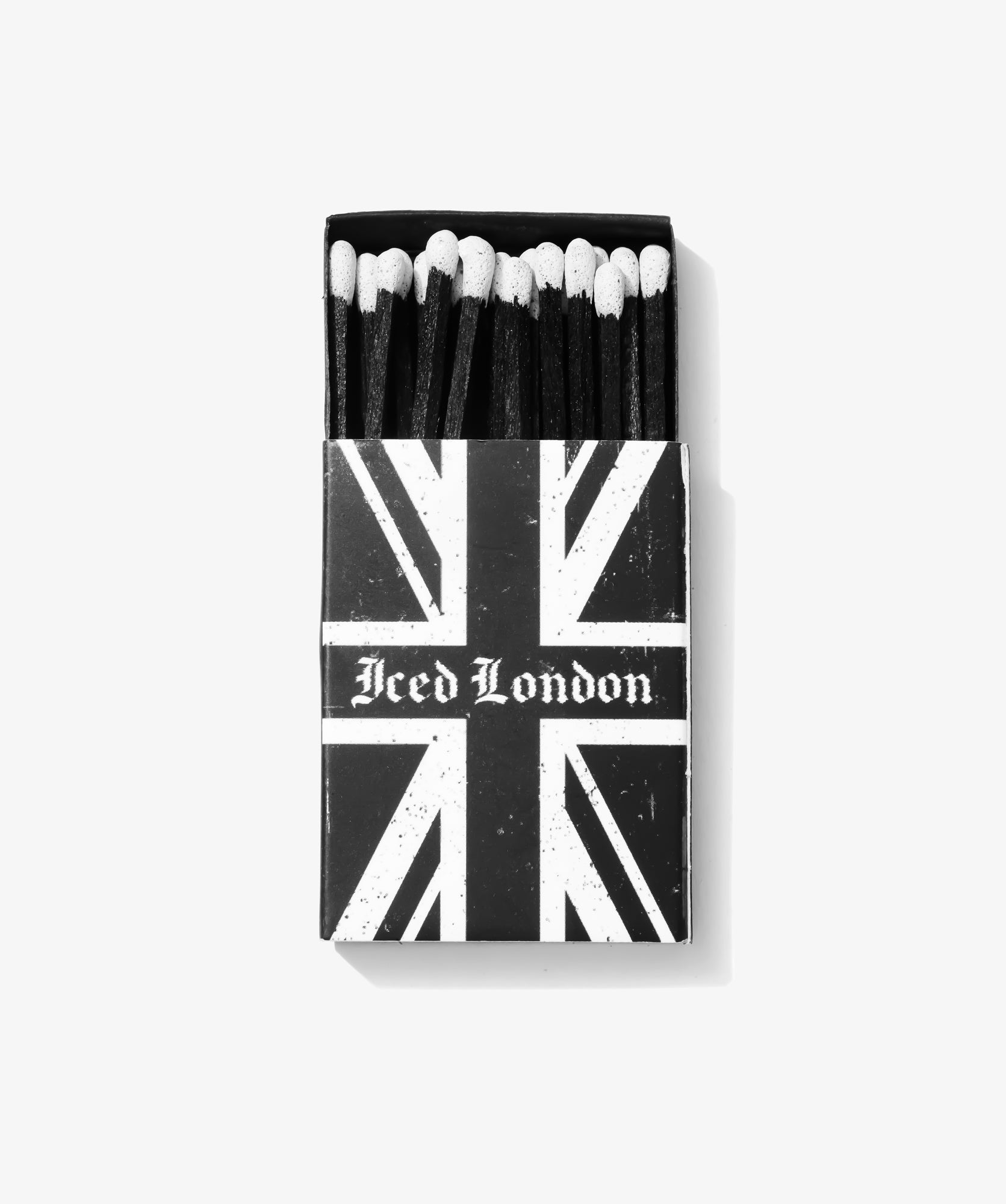ICED London matchbox with a distressed Union Jack design, opened to reveal matches with white-tipped heads.