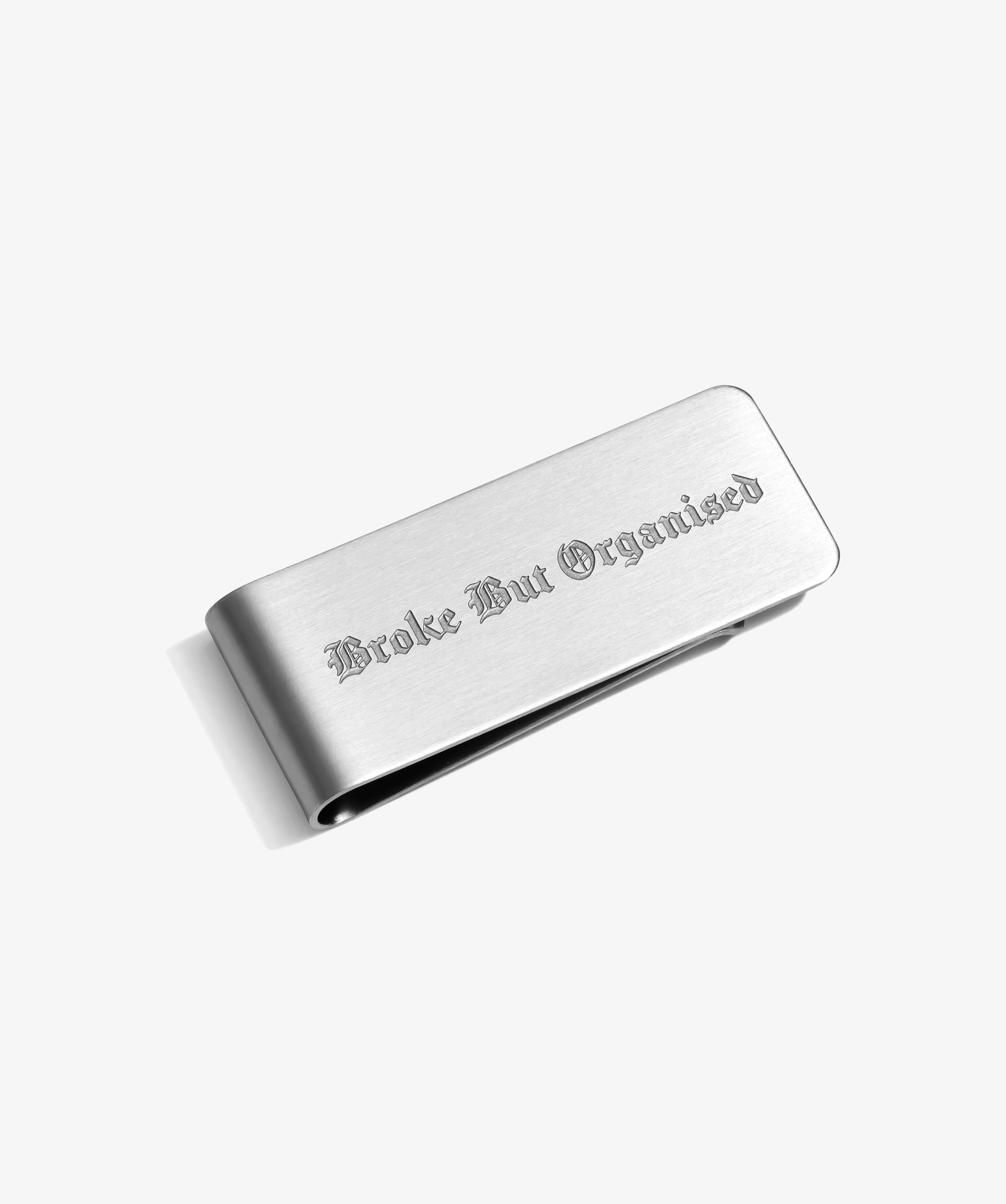 ICED London metal wallet, brushed silver finish, engraved Gothic text “Broke But Organized.”
