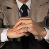 The Inverted Diamond Band worn on the little finger with tailored outerwear