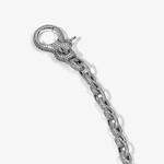 ICED London diamond-encrusted silver chain bracelet with round pavé clasp, close-up showing textured links.